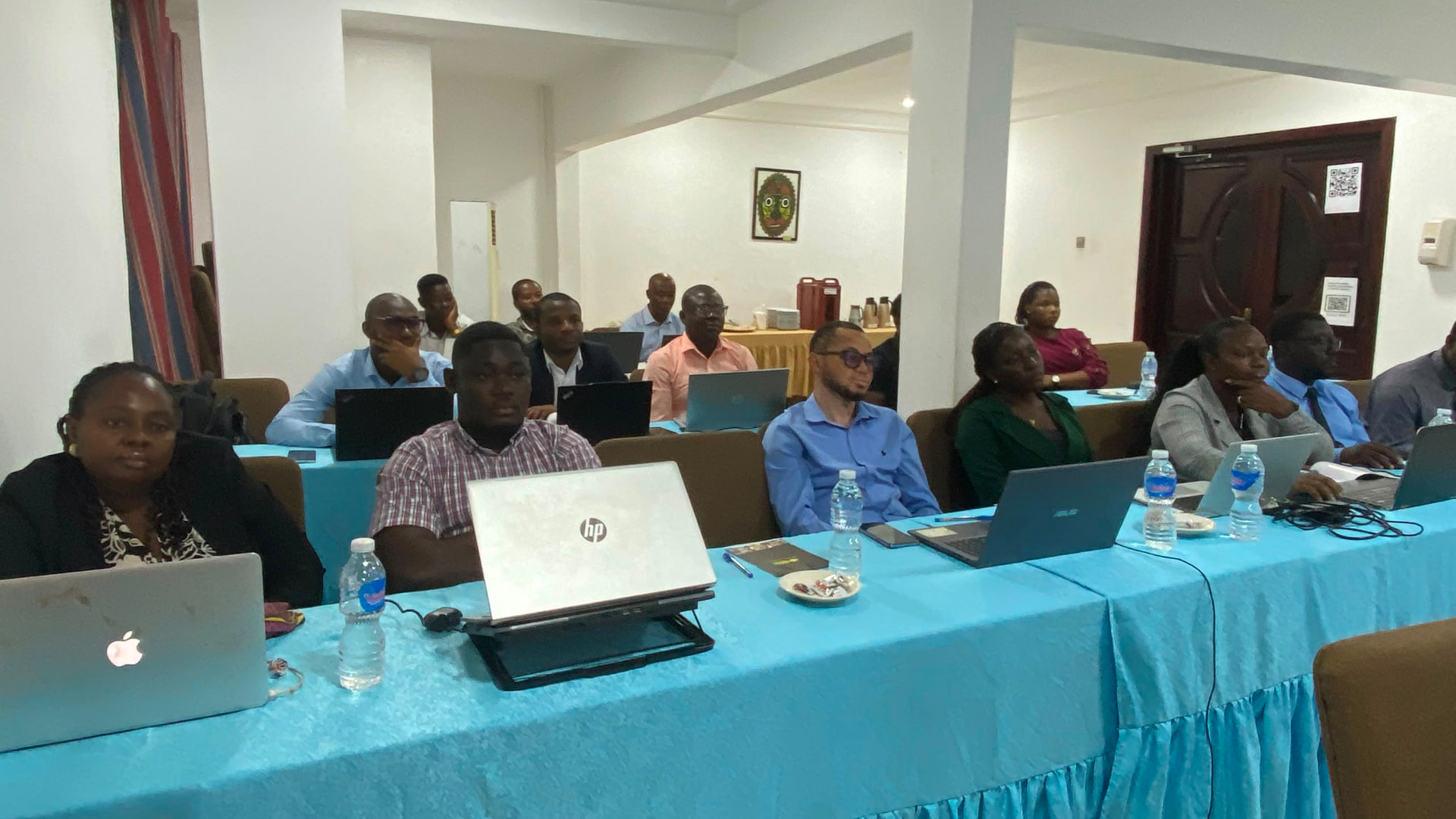 A full classroom of professionals attending a hands-on training programme